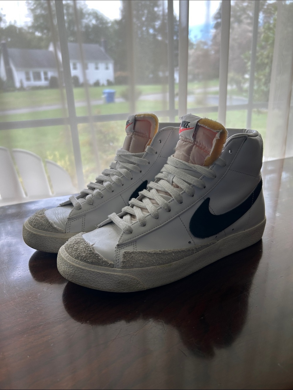 Nike Women’s White High-Top Sneakers with Black Swoosh and Cream Accents